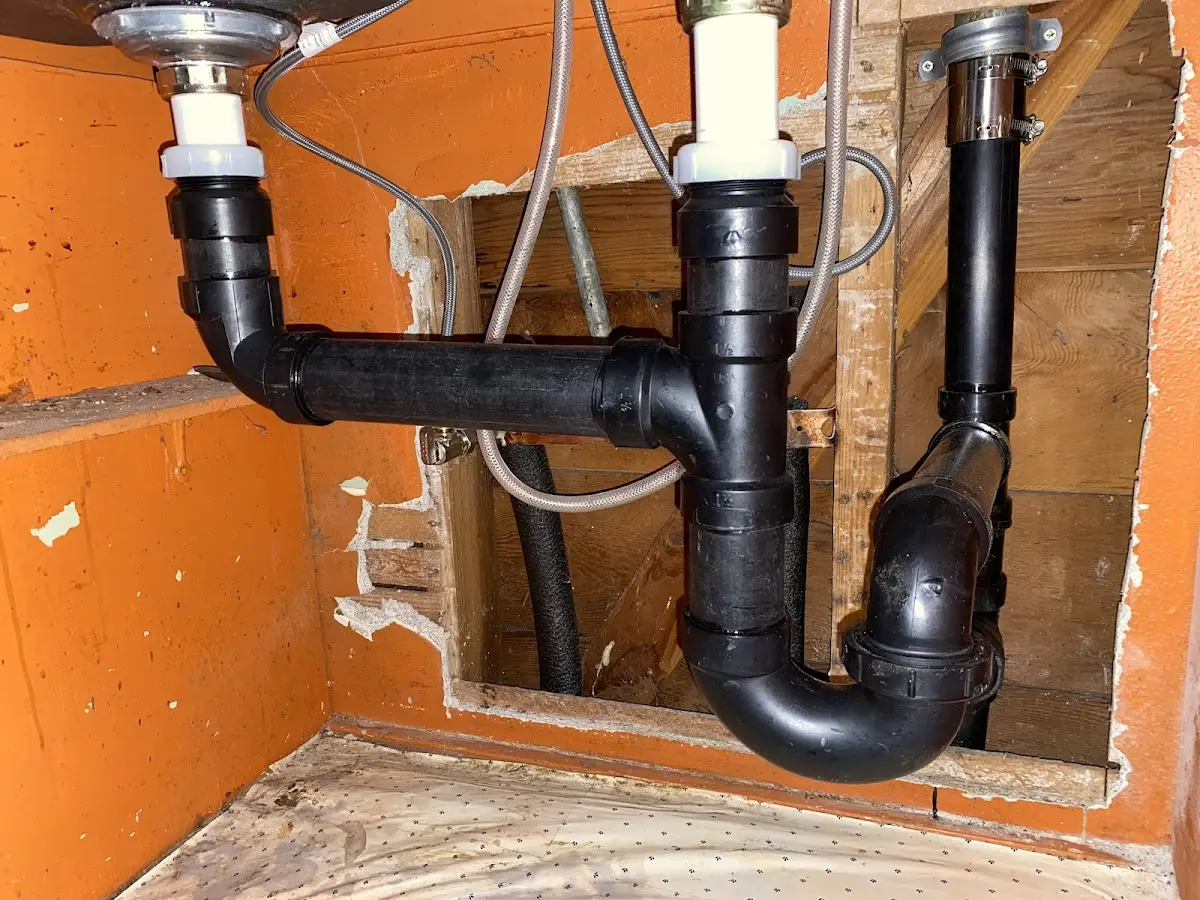 Professional Garbage Disposal Repair equipment and tools on the job in Central City